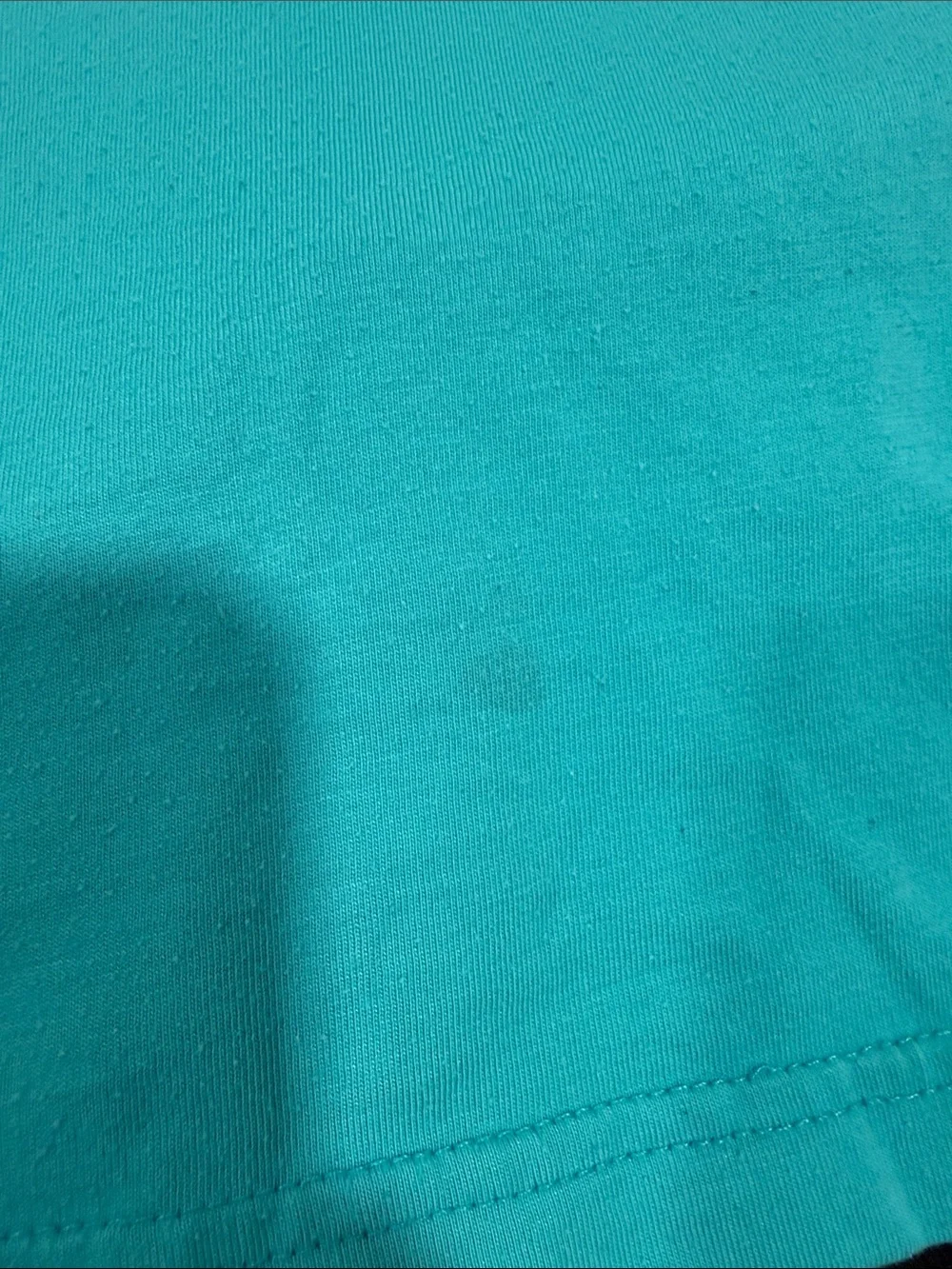 Nike Teal Graphic Tee with Black Athletic Shorts. Light stain as pictured.